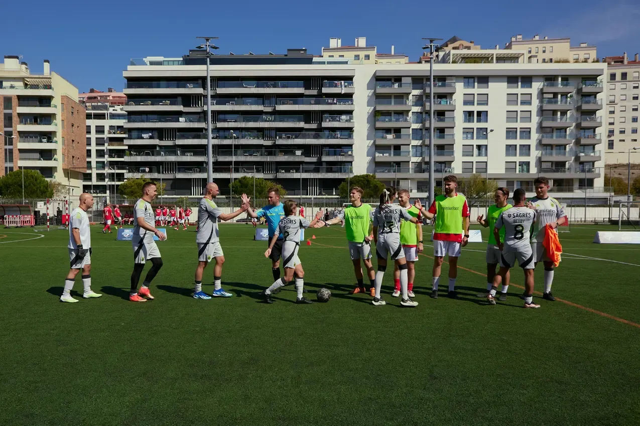 Teams gathering on the pitch before the SBC Football Championship match