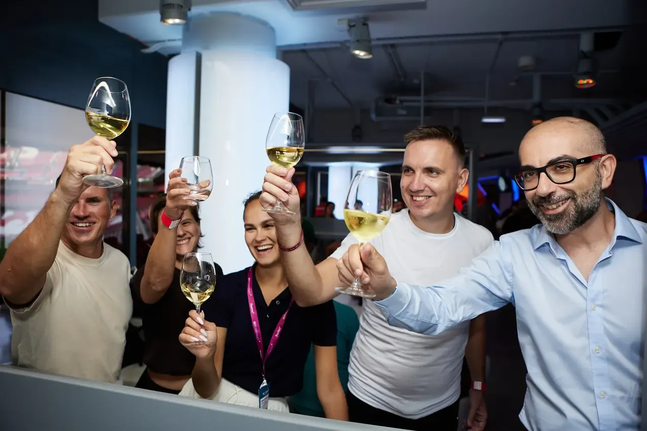 Group raising glasses in the Estádio da Luz lounge