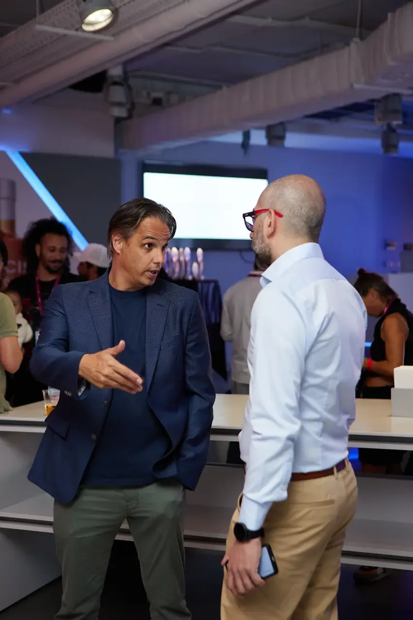 Two guests talking in the stadium lounge