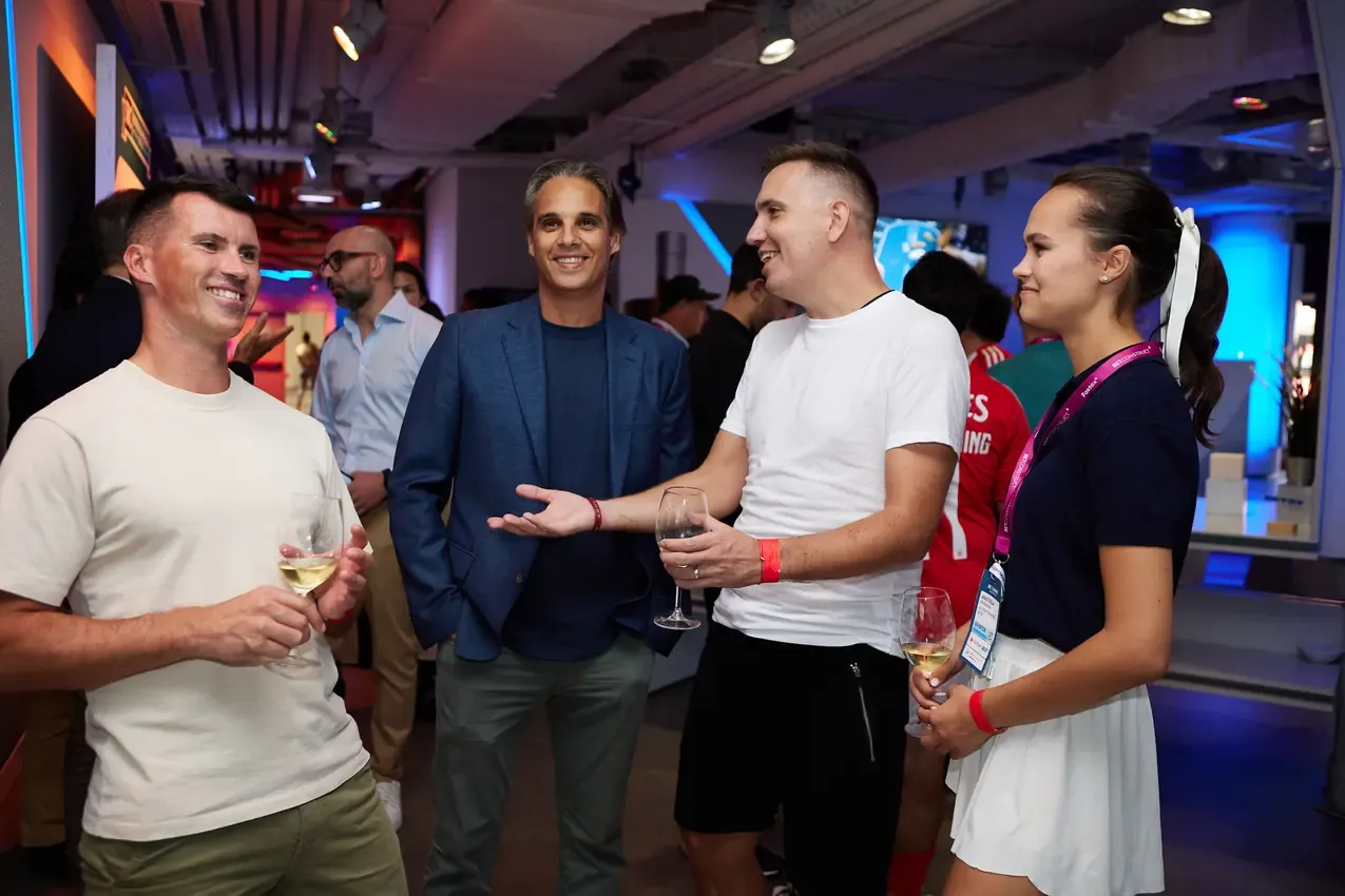 Players and sponsors talking in the lounge