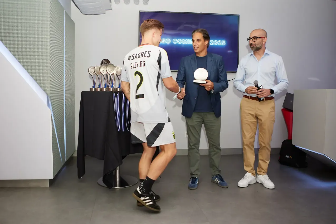 Award handed to a player in front of the trophy table