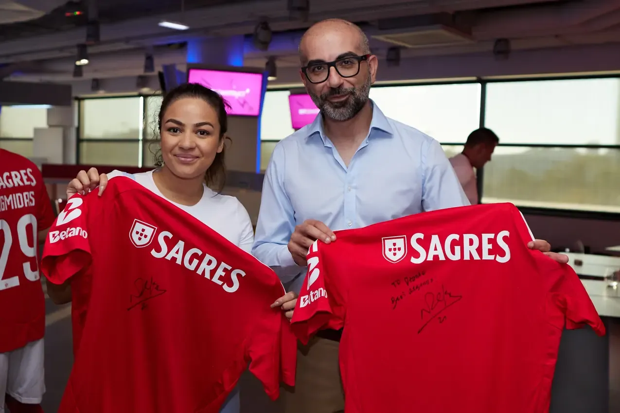 Signed Sagres Benfica shirts held up after the autograph session