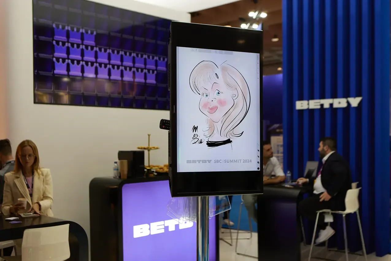 Caricature displayed on the screen at the Betby stand
