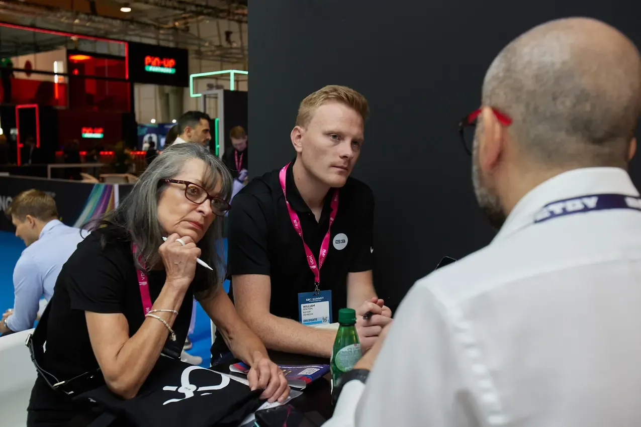 Betby team in a seated meeting with visitors