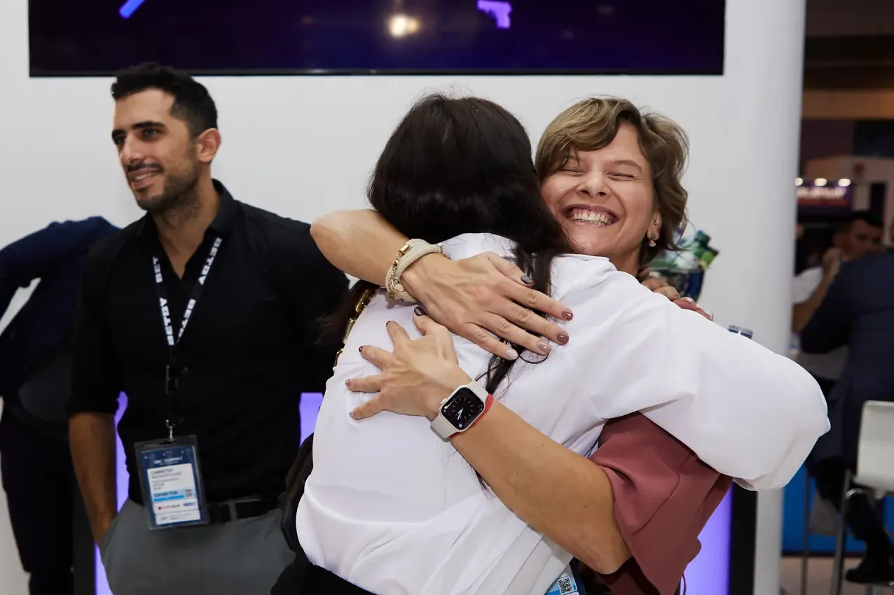 Hug between colleagues as SBC Summit 2024 closes