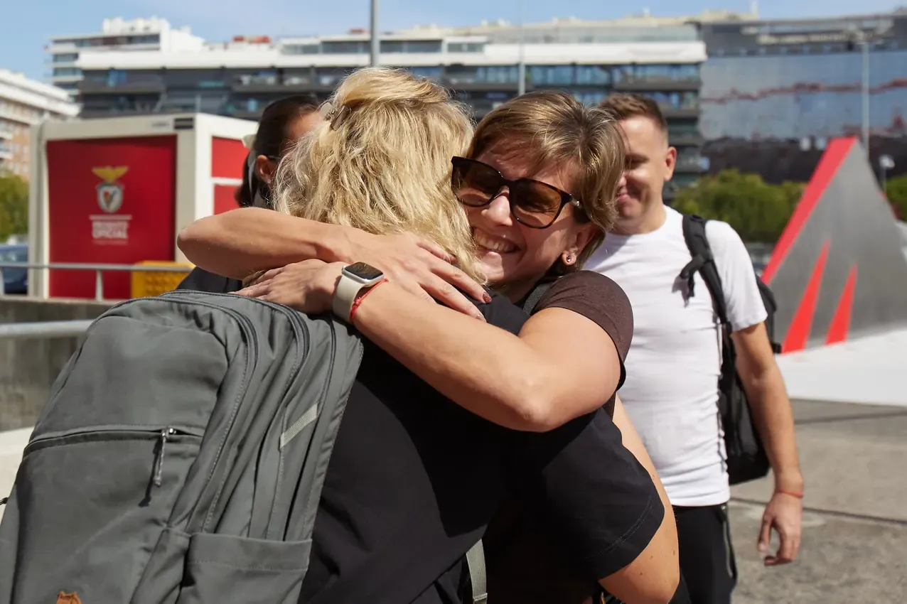 Teammates greeting each other on arrival