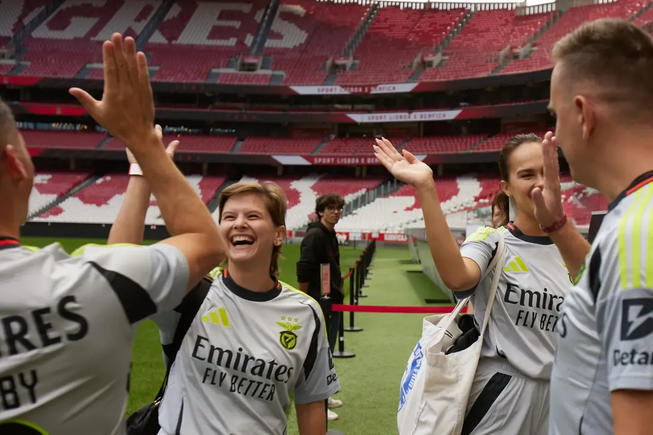 Betby players high-fiving on the pitch at Estádio da Luz before the SBC Football Championship